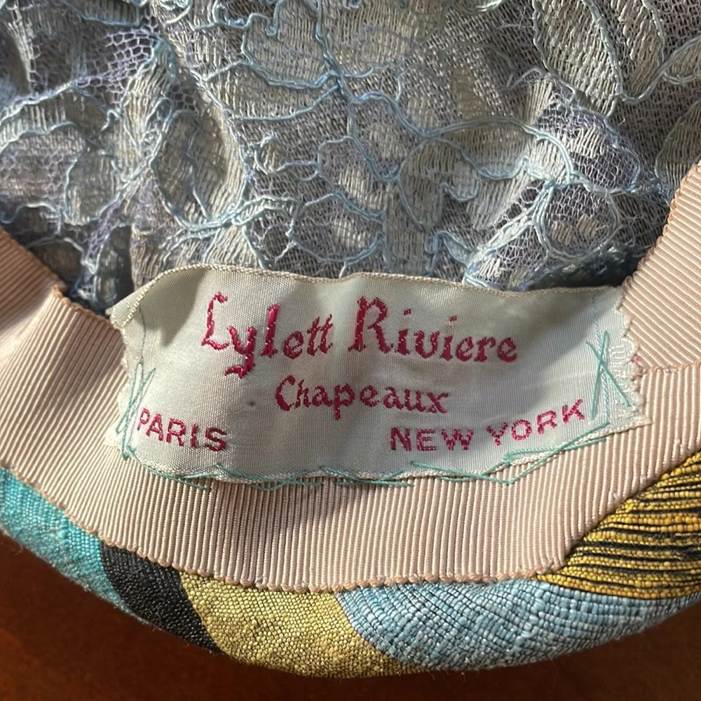 Vintage pin back hat Lynette Riviere